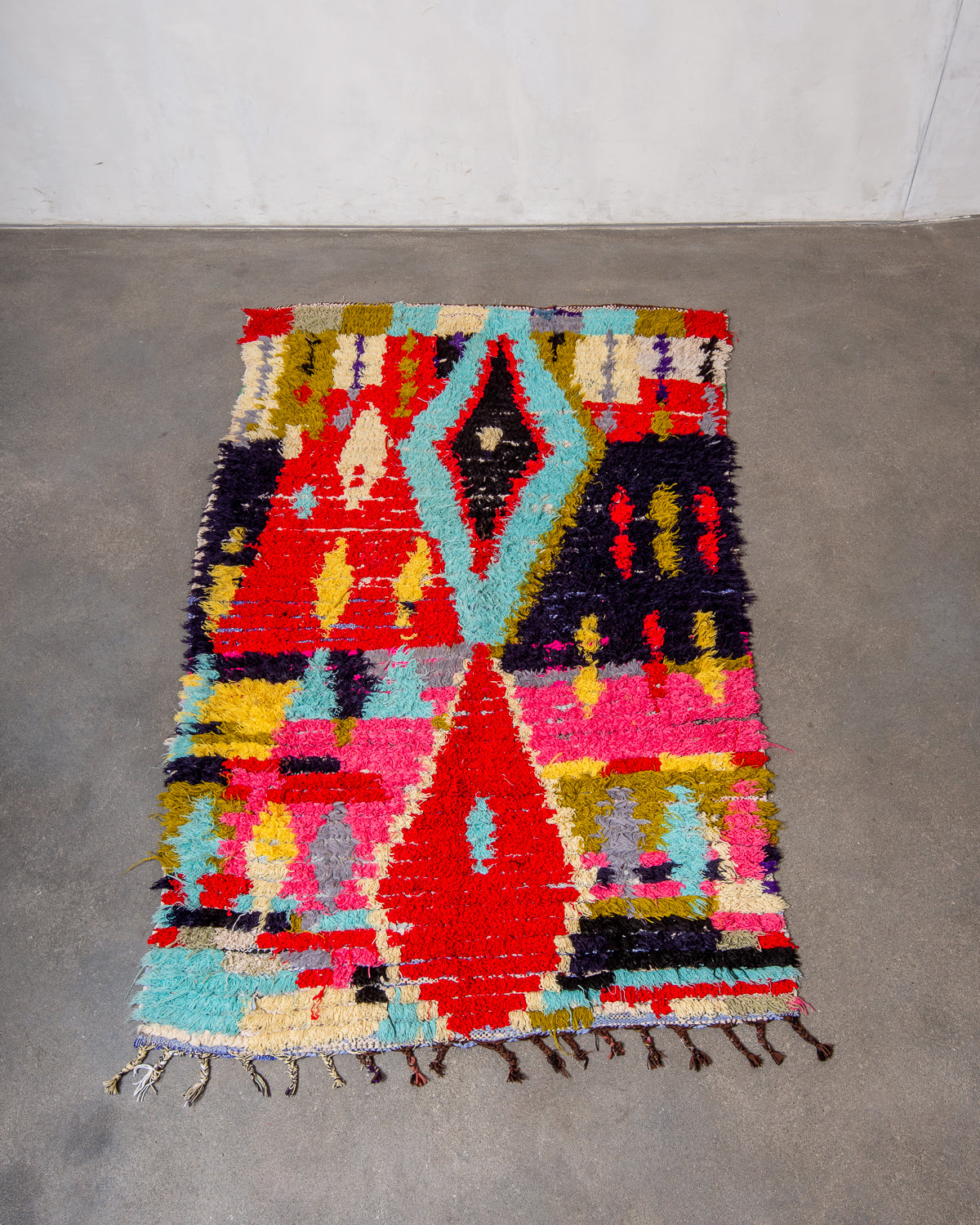 Modern designer vintage handcrafted Berber rug from Morocco. Boucherouite runner rug with beautiful colors and patterns.